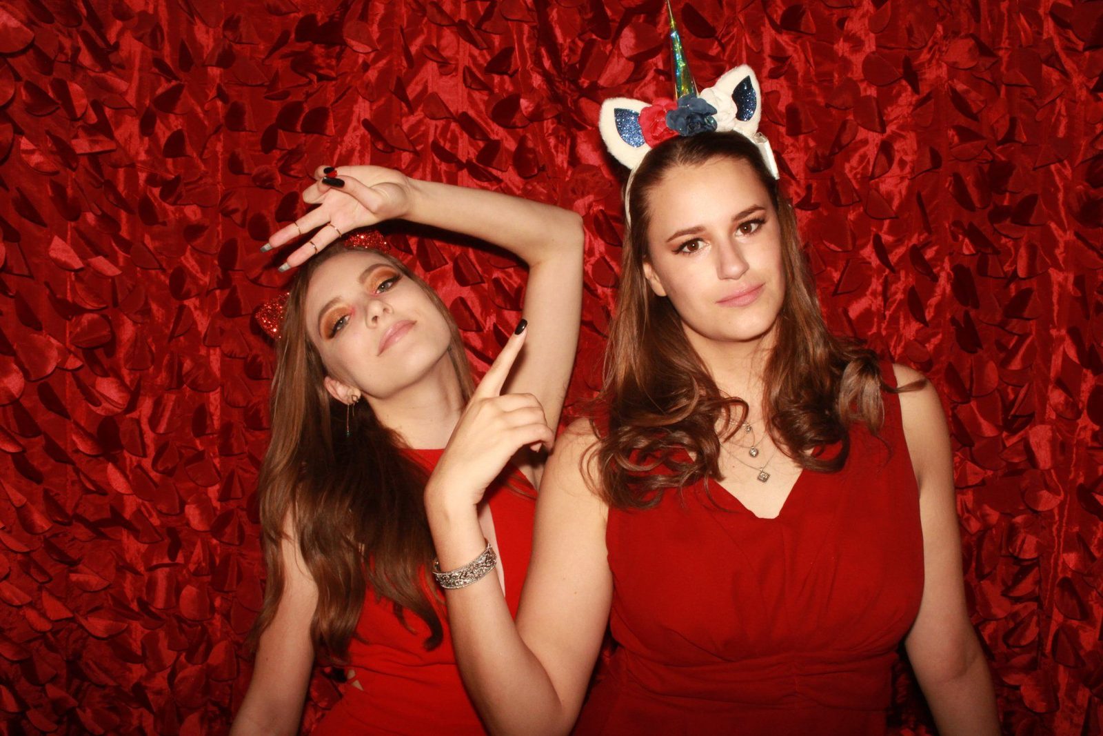 Burnt red petal backdrop for petite enclosed photo booth.